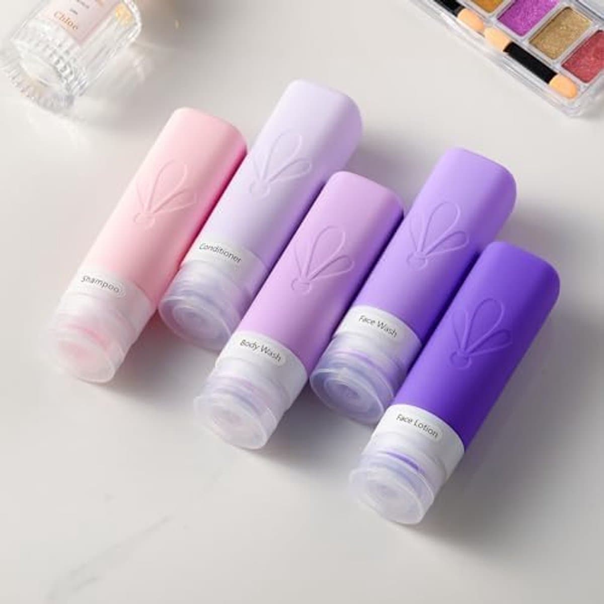Reisflessen om te vullen, TSA-goedgekeurde 90 ml siliconen reisflessen, BPA-vrije, lekvrije reisformaat container - Holiday Essentials voor vrouwen, reisset vloeistoffen inclusief toilettas — afbeelding 1