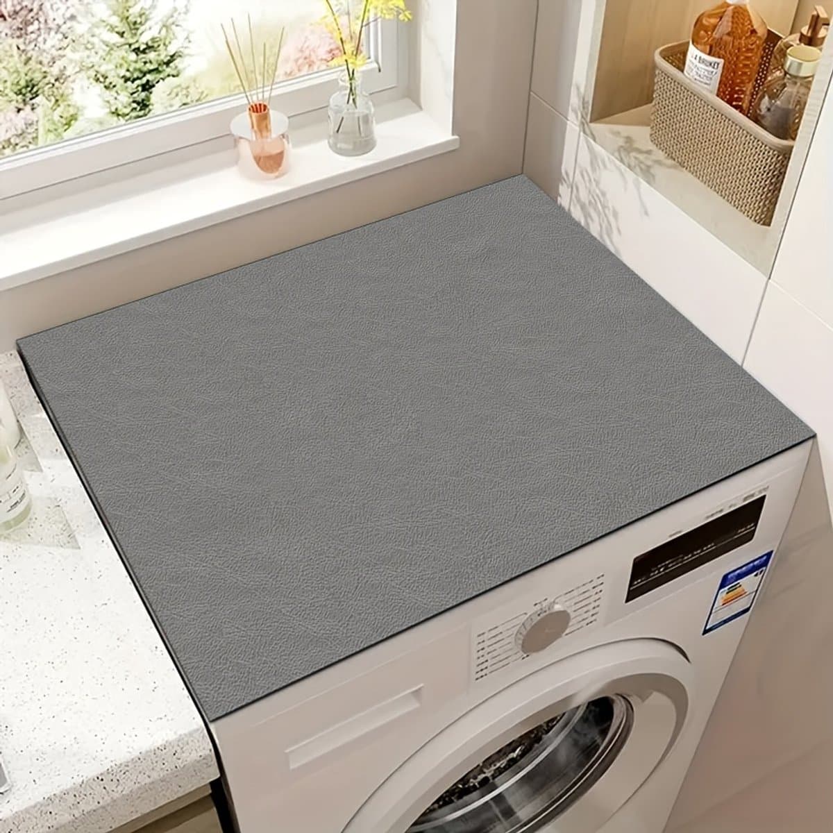 Een effen, gestructureerde beschermmat voor de deksel van de wasmachine en droger, die snel droogt, zeer absorberend is en antislip. — afbeelding 1